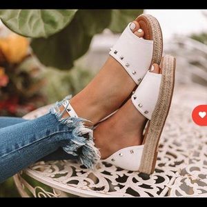 Cute ankle strap sandles with an inch of height.